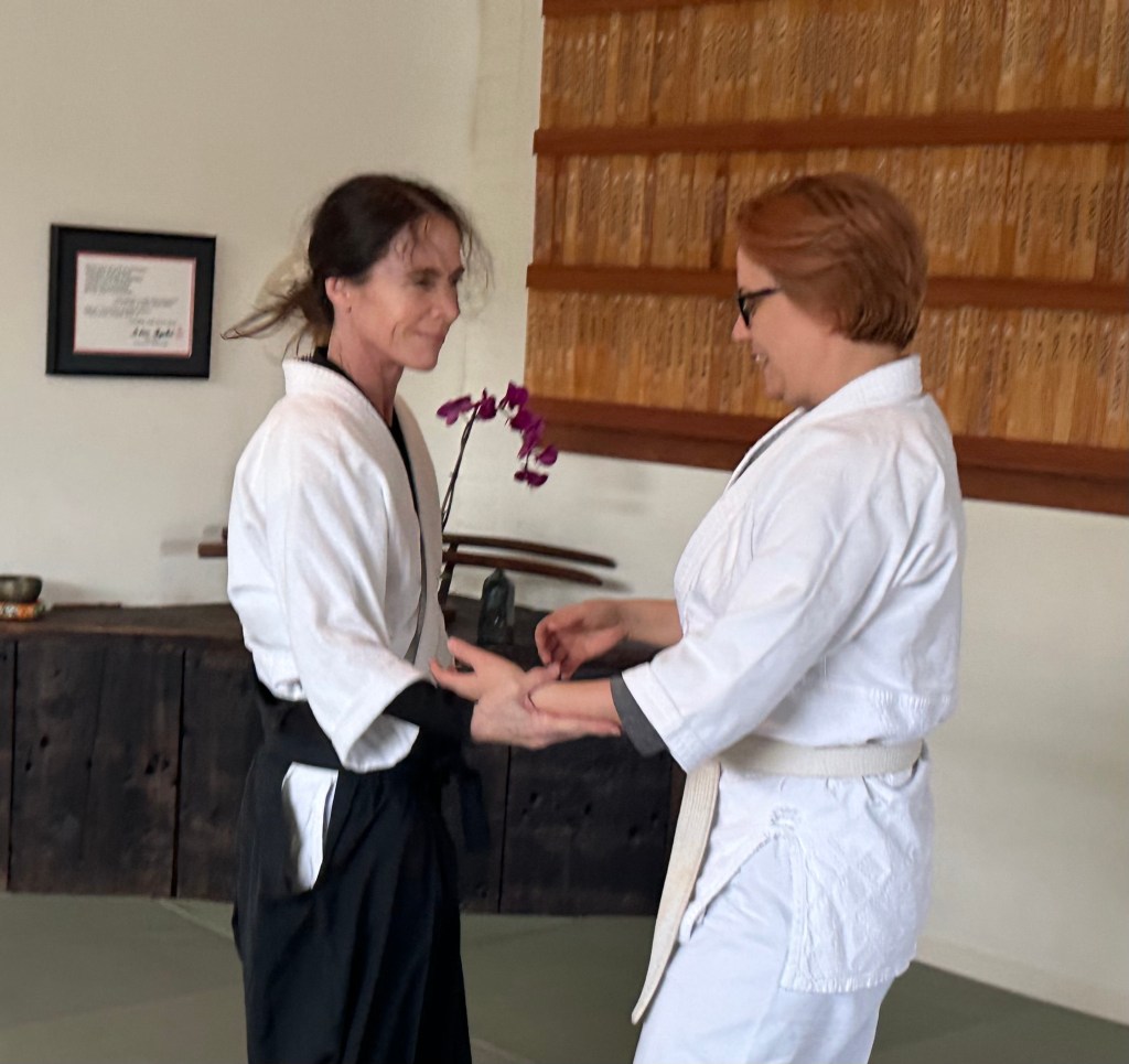 Laura and Jaime practicing aikido.